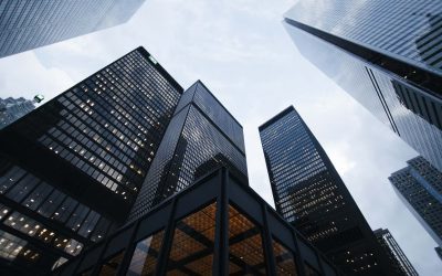 Glass commercial skyscrapers viewed from street level - Catalyst Property Finance launches development finance to 95% loan to cost