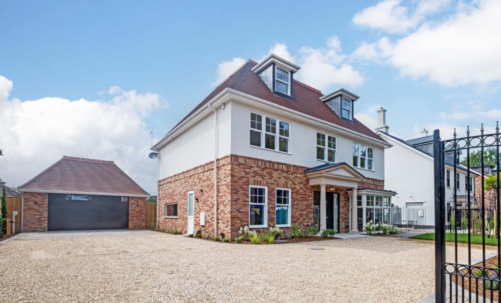 Newly built detached house with brick and render finish on the South Coast - ground-up development finance by Catalyst Property Finance