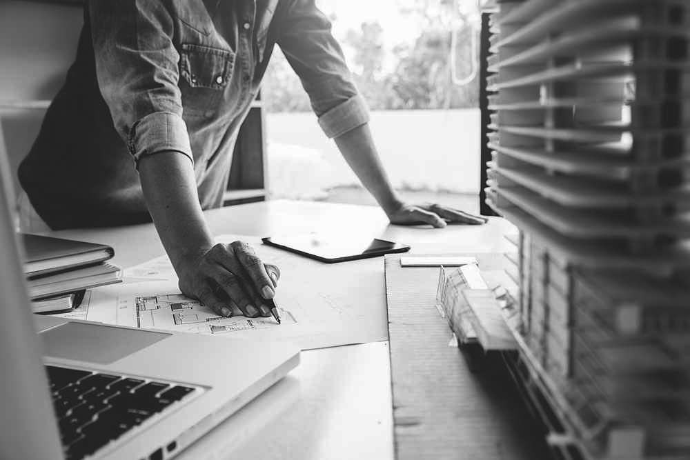 Property developer reviewing plans for a residential development exit loan project